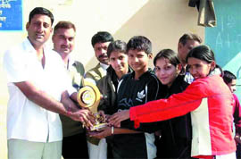 Cagers receiving award for their performance.