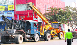 Encroachment by crane owners at the motor market in Mani Majra where the MC keeps conducting anti-encroachment drives.