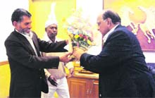 Uttarakhand Food and Supplies Minister Diwakar Bhatt with Union Food and Civil Supplies Minister Sharad Pawar in New Delhi on Monday. 