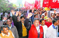 Uttarakhand government employees take out a rally in Dehradun on Monday.