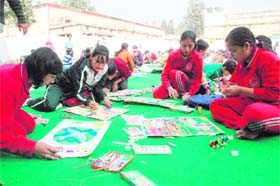 Children participate in a painting competition at MKP Inter-College in Dehradun