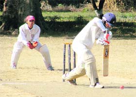 A batsman plays a shot at the Beehive Challengers Trophy 13th T20 Inter District Cricket Tournament in Dehradun