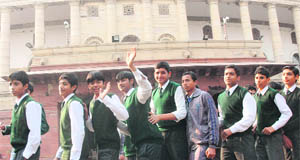 Students of the DPS, Sonepat, during a visit to Parliament House during the ongoing winter session in New Delhi on Monday.