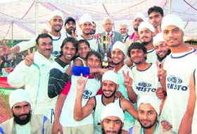 The Kurukshetra University team in a jubilant mood after receiving trophy for winning the Inter-University Hockey Championship in Jammu