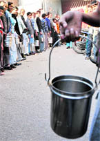 Residents queue up to get milk in Janakpuri as shops remained closed due to curfew and bandh In Ludhiana on Monday.