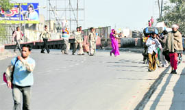 As curfew was relaxed for sometime, migrants were seen leaving for native villages on Monday.