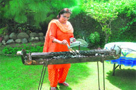Neena Singh grilling honey marinated seekh kabab 