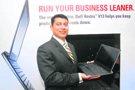 Ravi Bharadwaj, general manager, Dell India, poses with ultra-portable Dell Vestro V13 laptop at its launch in New Delhi on Tuesday. 'Vostro V13' is aimed at small and medium businesses and is priced at Rs 28,500. It is 16.5 mm thick, weighs 1.59 kg and is equipped with ultra-low-voltage Intel (ULV) processors to manage energy efficiency. 