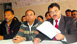Leader of the Congress in the DMC Ashok Verma (extreme right) addresses a press conference in Dehradun on Tuesday. A Tribune photograph
