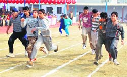 Students take part in a three-legged race during the athletics meet at BCM School, Dugri, on Tuesday. 