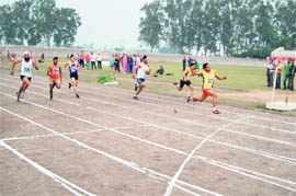 Participants take part in a race during the 47th Annual Athletics Meet of Punjabi University, Patiala, on Wednesday.