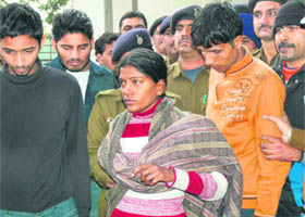 Members of the inter-state gang of mobike thieves, including a woman, at the Burail police post in Chandigarh on Wednesday.