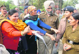 Anganwadi workers stage a protest outside the Punjab Chief Ministers residence in Chandigarh on Wednesday.