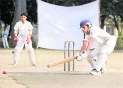 A batsman hits a shot at the Beehive T20 Cricket Tournament in Dehradun on Thursday. 