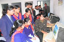 Students of Hari Ram Inter College, Mayapur, get computer training at a workshop in the college.