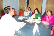 Members of the Janwadi Mahila Samiti give a memorandum to an official in Dehradun on Thursday. 