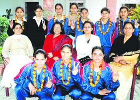 Team members with college staff