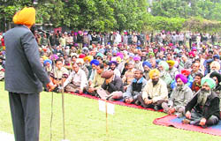 PAU employees hold rally in Ludhiana on Thursday.