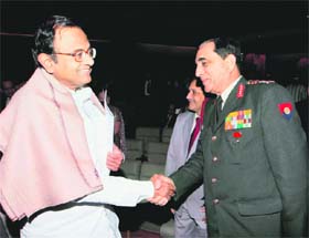 Union Home Minister P Chidambaram shakes hands with Army chiefGeneral Deepak Kapoor during a function organised on Human Rights Dayin New Delhi on Thursday.