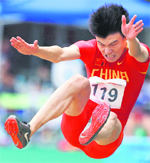 Chinas Li Jinzhe competes during the mens long jump final at the East Asian Games in Hong Kong