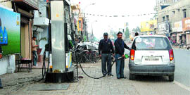 Petrol being filled in a car at a small filling station meant for two-wheelers only in Amritsar