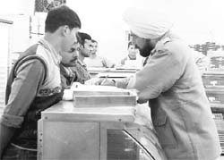 A police official inquires into the robbery at a dairy in Sector 21, Panchkula, on Friday.