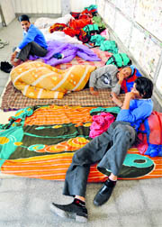 Hockey players brave the chill by sleeping on the floor in Ludhiana on Friday.