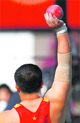 Chinas Zhang Jun competes in the mens shot put final at the East Asian Games in Hong Kong on Thursday. 