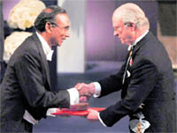 Dr Venkatraman Ramakrishnan, left, receives the Nobel Prize in chemistry from King Carl XVI Gustaf of Sweden during the Nobel prize award ceremony in Stockholm, Sweden, on Thursday.  AP/PTI