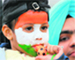 a child cheers for Team India.
