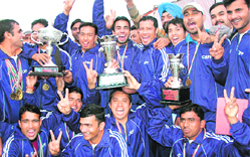 CRPF jawans in a jubilant mood after winning the overall trophy at Sukhna Lake in Chandigarh 