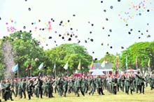 Gentlemen cadets throw their caps in the air after becoming officers of the Indian Army after the passing-out parade of Indian Military Academy in Dehradun on Saturday.
