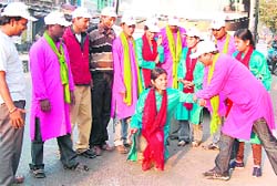 Social activists enact a street play to make people aware about AIDS