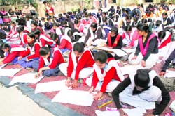 Participants during a painting competition at Rajkiya Inter College, Khurbura, on Saturday. 