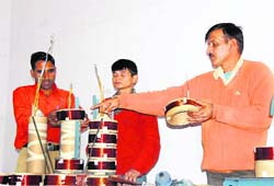 An engineer explains about the repair of transformers at a workshop in Dehradun on Saturday. 