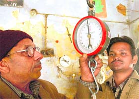 Bal Krishan Thakur (left) oversees production at his small unit in Ambala