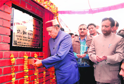 Chief Minister Prem Kumar Dhumal laying the foundation stone of Kangra Cooperative Bank head office building at Dharamsala