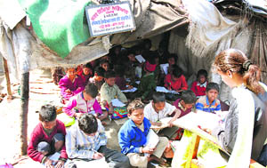 Students of a labour school study in a Ludhiana slum.