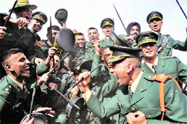 Gentlemen cadets rejoice after the passing-out parade at the Indian Military Academy in Dehradun on Saturday.