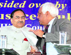 Justice DK Jain (left), Judge, Supreme Court of India, and Justice Mukul Mudgal, Chief Justice of the Punjab and Haryana High Court, discuss a point in the Amritsar District Courts complex on Saturday.