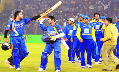 Bday Boy Shines: Yuvraj Singh (L) slammed 60 off 25 balls to take India to a six-wicket win in the 2nd T20 against Sri Lanka in Mohali on Saturday.