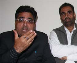 Vice-chairman of the Small Traders Board, Punjab, DP Chandan (left) speaking to media in Bathinda on Sunday.