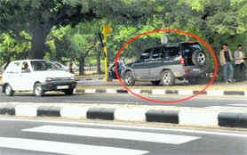 A vehicle on the cycle track at Sectors 19 and 20 dividing road in Chandigarh on Sunday. 