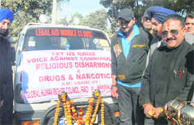 Cricketer Harbhajan Singh launches Legal Aid Mobile Clinic at Sector 22 in Chandigarh on Sunday.