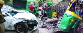 An Audi car and an autorickshaw that met with an accident at Chirag Dilli in New Delhi