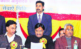 Chief Minister Ramesh Pokhriyal Nishank attends a function at Rishikul Ayurveda Medical College in Haridwar on Sunday. 