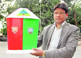 Harak Singh Rawat, SDM, Dhanaulti, with his innovation of a garbage box to be used at hill tourist resorts