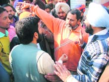 Senior Deputy Mayor Praveen Bansal argues with the occupants of a plot at Kidwai Nagar in Ludhiana on Sunday.