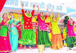Students perform gidda during an annual day function of GHG Academy at Jagraon. 