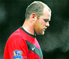 Manchester Uniteds Wayne Rooney leaves the pitch after their defeat at Old Trafford, Manchester, on Saturday.